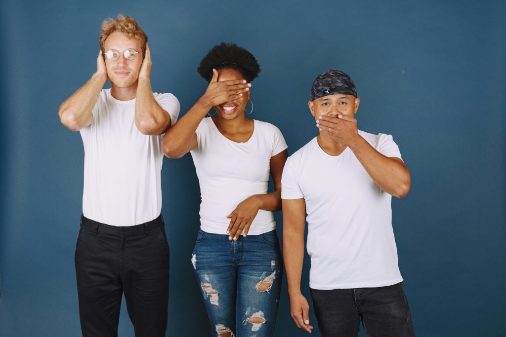 Three People Doing Different Facial Expressions